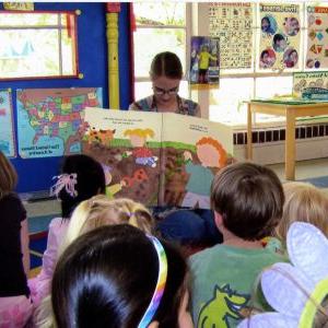 A teacher at the UM Child Study Center reads to students.